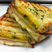 Cuban Panini  · Roasted chicken, black forest ham, baby swiss, bread and butter pickles, red pepper mustard ...
