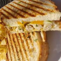 Granny Apple Panini  · Grilled chicken, granny smith apple slices, aged cheddar, and dijon mustard. Served on hot p...