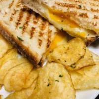 The Big Cheese Panini  · Melty baby swiss, aged cheddar, and smoked provolone topped with a roasted red pepper sauce ...