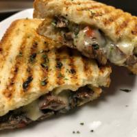 Veggie Panini  · Portabello mushrooms, red onion, red pepper and smoked provolone topped with a balsamic pest...