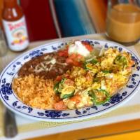 Huevos a la Mexicana Desayunos · Scrambled eggs, jalapenos, tomato, and onion. Served with rice and beans.