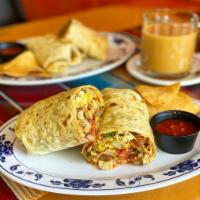 Breakfast Burrito · Scrambled eggs, cheese, jalapeños, green bell pepper, potatoes, onions and tomatoes wrapped ...