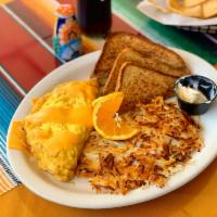 Omelette Desayunos · Omelette with bell pepper, onions, cheese, and bacon with a side of hash browns and toast.