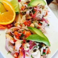 Jaiba Tostada · Crab ceviche cured in lime juice, topped with red onion, cilantro, avocado, tomatoes. 