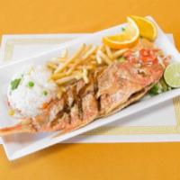 Huachinango Frito · Fried red snapper. Served with rice, french fries and a fresh salad.