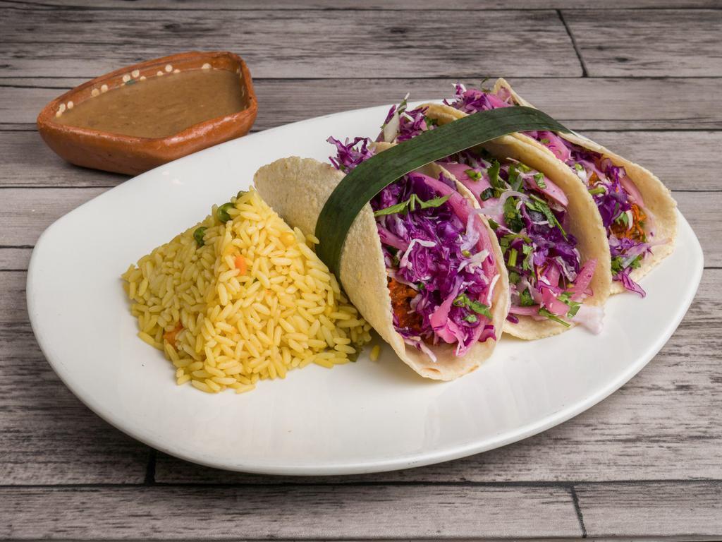 3 Cochinita Pibil Tacos · Handmade corn tortilla, delicious pibil style braised pork, served with pickled red onion, topped with cilantro, and habanero relish.