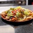 Nachos al Carbon · Fajita meat choice beef or chicken, beans, lettuce, Monterey Jack cheese, jalapeno peppers, ...