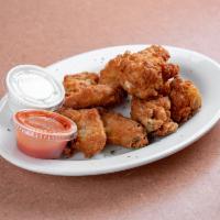 Buffalo Wings · 8 pieces. Chicken wings breaded and fried, then tossed in buffalo sauce.