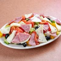 Antipasto Salad · Chopped cured meats, fresh cheeses, and briny olives.