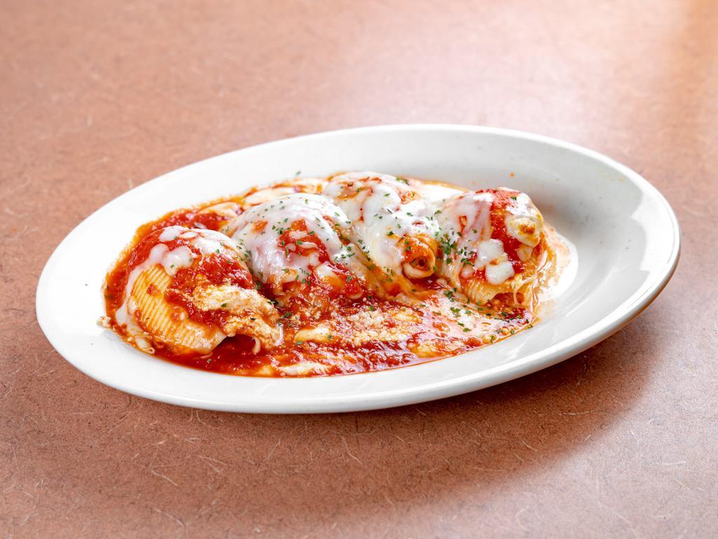Stuffed Shells · Classic ricotta stuffed shells with flavorful three cheese ricotta filling and delicious marinara sauce