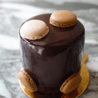 Anne · Dark chocolate mousse with crème anglaise center, hazelnut crunch and chocolate biscuit, cov...