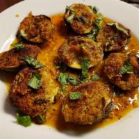 Baked Clams Oreganato · Stuffed with homemade seasoned breadcrumbs.