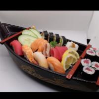 Sushi Deluxe Combo · 6 pieces of fish sashimi, 4 pieces of sushi nigiri, 6 pieces of tuna roll, 6 pieces of spicy...