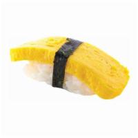 Sweet Egg Nigiri · Sushi laid top of rice.