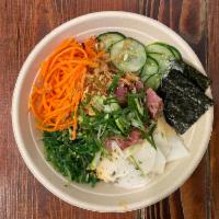 Poke · Sashimi grade tuna or seared shrimp, seaweed salad, nori, pickled carrots, scallions, daikon...