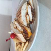 The Texan Panini · Grilled chicken, crispy bacon, melted cheddar and fried onions with BBQ sauce.