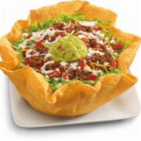 Beef Taco Salad · Seasoned ground beef with pinto beans, shredded lettuce, fresh salsa, four-cheese blend and ...