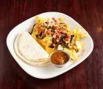 Migas · Scrambled eggs, tortilla strips, jalapenos, tomatoes, and onions, topped with aged cheddar. ...