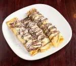 Banana Nutella Crepes · Stuffed and topped with bananas and Nutella.