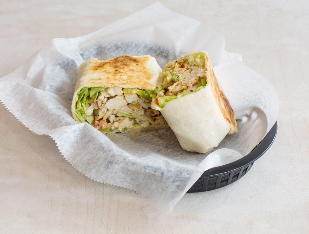 Signature Wrap · Large wrap with chopped lettuce, diced tomatoes, grilled chicken and creamy ranch. Options to add cheese and rice.