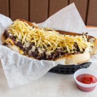 The Spot Giant Steak Sandwich · Sizzling grilled steak a nd red onions sitting on melted cheddar cheese inside a large hero ...