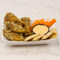 Zesti GoGreek Wings · 6 crispy wings tossed with tangy hot sauce with a side of spicy feta, carrots, and pita bread.