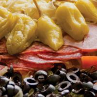 Antipasto Salad · Hand-leafed lettuce topped with mozzarella cheese, sliced ham, salami, black olives, diced t...