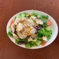 Grilled Chicken Salad · Crisp lettuce, tomatoes, red onions, red cabbage, pepperoncini, black olives, mozzarella, ch...