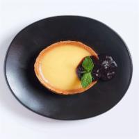 146. Lemon Tart · Served with a berry compote.
