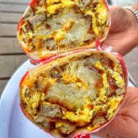 Combo Burrito · Include 3 eggs, bacon, sausage, ham, hash browns, cheese & salsa on the side.