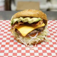Bacon Avocado Cheeseburger · Dressed with 1000 Island, lettuce, onions, tomato, and pickle on a sesame seed bun.