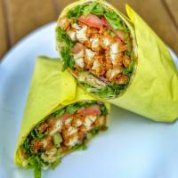 Crispy Chicken Wrap · Hand breaded chicken tenders fried to perfection! Includes mixed greens, diced tomatoes, shr...