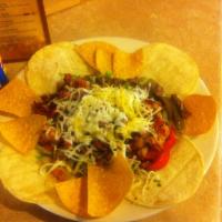 Alambre · Authentic Mexican dish with grilled steak, bacon, grilled onions and bell peppers. Served wi...