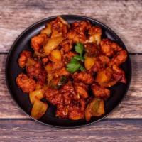 Chilly Chicken · Diced boneless chicken tossed with green bell pepper, onion and spicy house sauce.