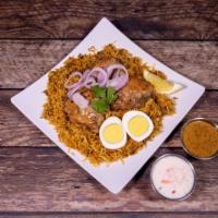 Chicken Biryani · Marinated chicken and spices cooked with basmati rice on a low heat.