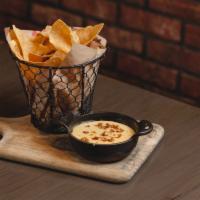Bacon Queso Dip  · Bacon Infused Cheese Sauce Served with Fresh Tortilla Chips