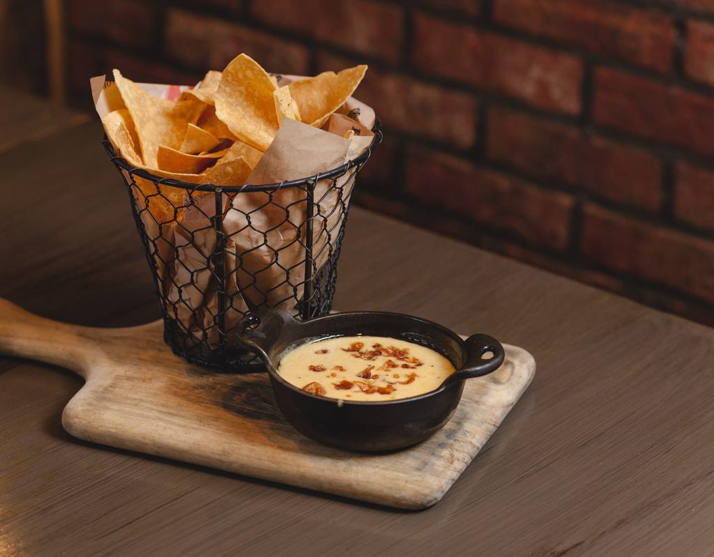 Bacon Queso Dip  · Bacon Infused Cheese Sauce Served with Fresh Tortilla Chips