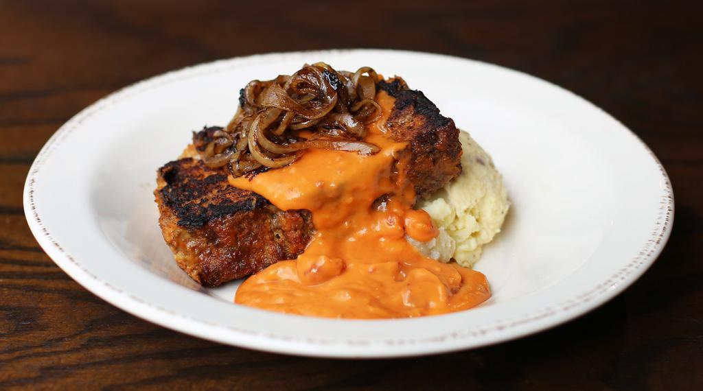 Meatloaf Plate · Housemade Meatloaf Seared on the Grill, Topped with Caramelized Onions and Tomato Gravy.  Serve with a Side of Smashed Potatoes. 