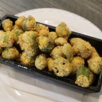 Fried Okra · 
 Hand dredged in buttermilk and seasoned cornmeal, fried to crispy perfection.
