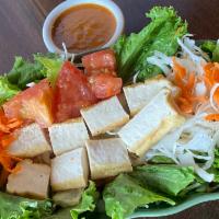 Thailander Fresh Salad with Tofu · Fresh salad mixed, lettuce, carrot, tomato, iceberg, cabbage with tofu and served with peanu...