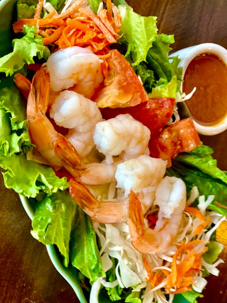 Thailander Fresh Salad with Shrimp · Fresh salad mixed, lettuce, carrot, tomato, iceberg, cabbage with shrimps and served with peanut sauce.