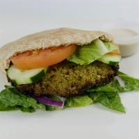89. Falafel · Baked falafel, hummus, lettuce, tomato and onions in a pita. Meat cooked to 165 degrees.