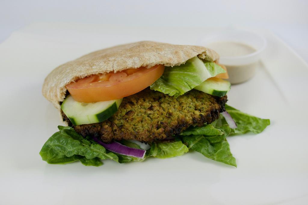 89. Falafel Sandwich · Baked falafel, hummus, lettuce, tomato and onions. Served on a wheat pita or seven-grain bread.