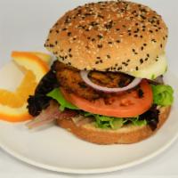 91. Veggie Burger · Made with carrots, corn, peppers, green beans, peas and onions. Served with lettuce, tomato ...