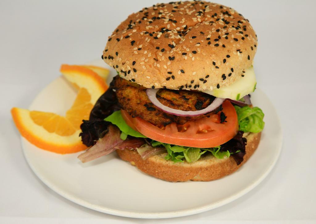 91. Veggie Burger · Made with carrots, corn, peppers, green beans, peas and onions. Served with lettuce, tomato and cucumber. Cooked to 165 degrees.