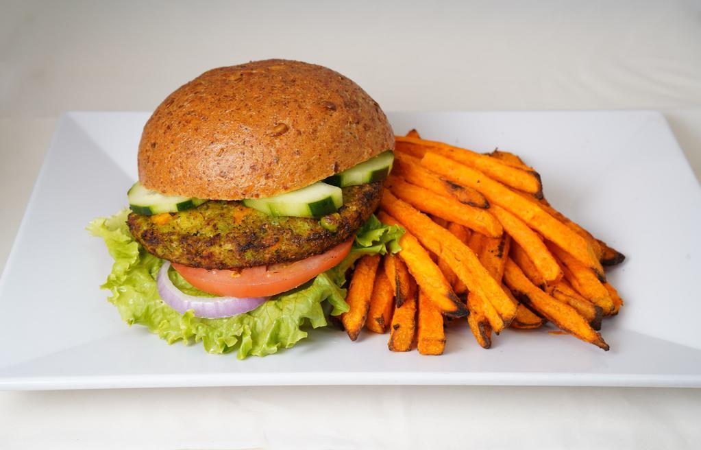 91. Veggie Burger Combo · Made with carrots, corn, peppers, green beans, peas and onions. Served with lettuce, tomato and cucumber. Cooked to 165 degrees. With baked air fries and choice of drink.