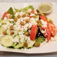 104. Greek Salad · Mixed greens, romaine lettuce, black olives, feta cheese, lemon, homemade seasoning, olive o...