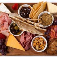 Indulgent Cheese and Charcuterie Board · Three artisan meats and seasonal cheeses accompanied with an accoutrement of fun things.