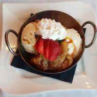 Warm Cinnamon Apple Crisp · Pastry filled with warm apple slices and a cinnamon sugar glaze.