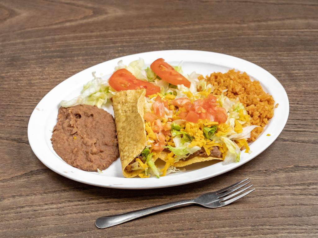20. Texas Plate · 1 crispy taco, 1 bean, cheese chalupa, rice, and beans. Comes with rice, beans, salad, and two homemade tortillas.

